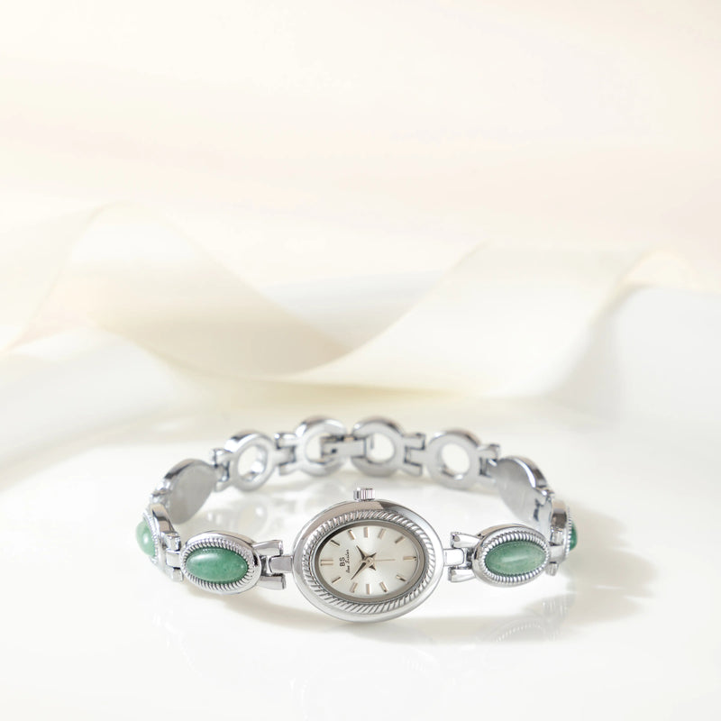 Clara – Goldene Uhr mit länglichem Zifferblatt.