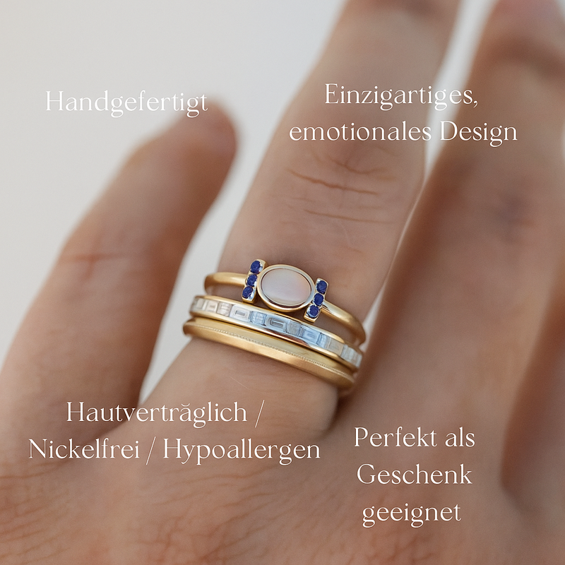 Theresa – Ein feiner Goldring mit schimmerndem Opal und klaren Konturen.