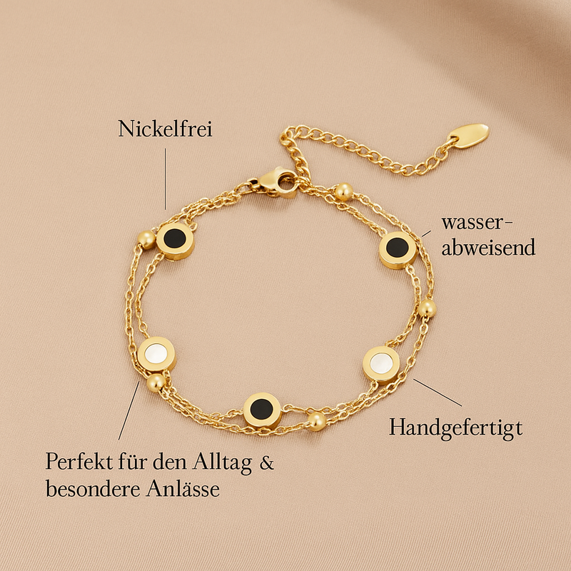 Carla – Ein zartes, goldfarbenes Armband mit kontrastreichen Rund-Elementen.
