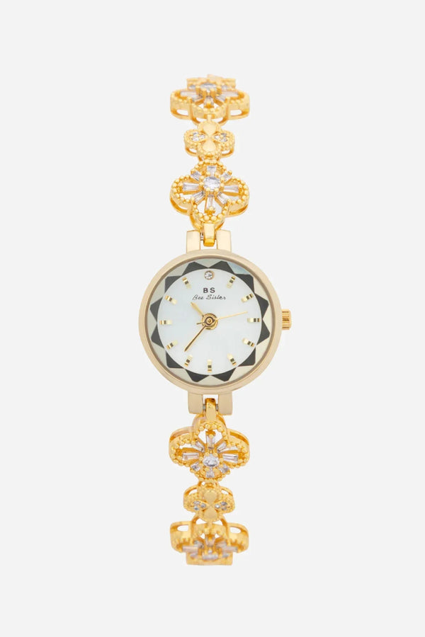 Elina – Goldene Uhr mit floral inspiriertem Armband.